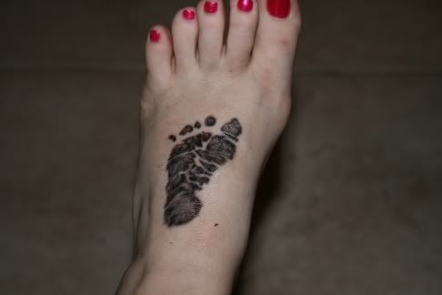 We got Anthony's Foot prints from the hospital tattooed on the top of our 